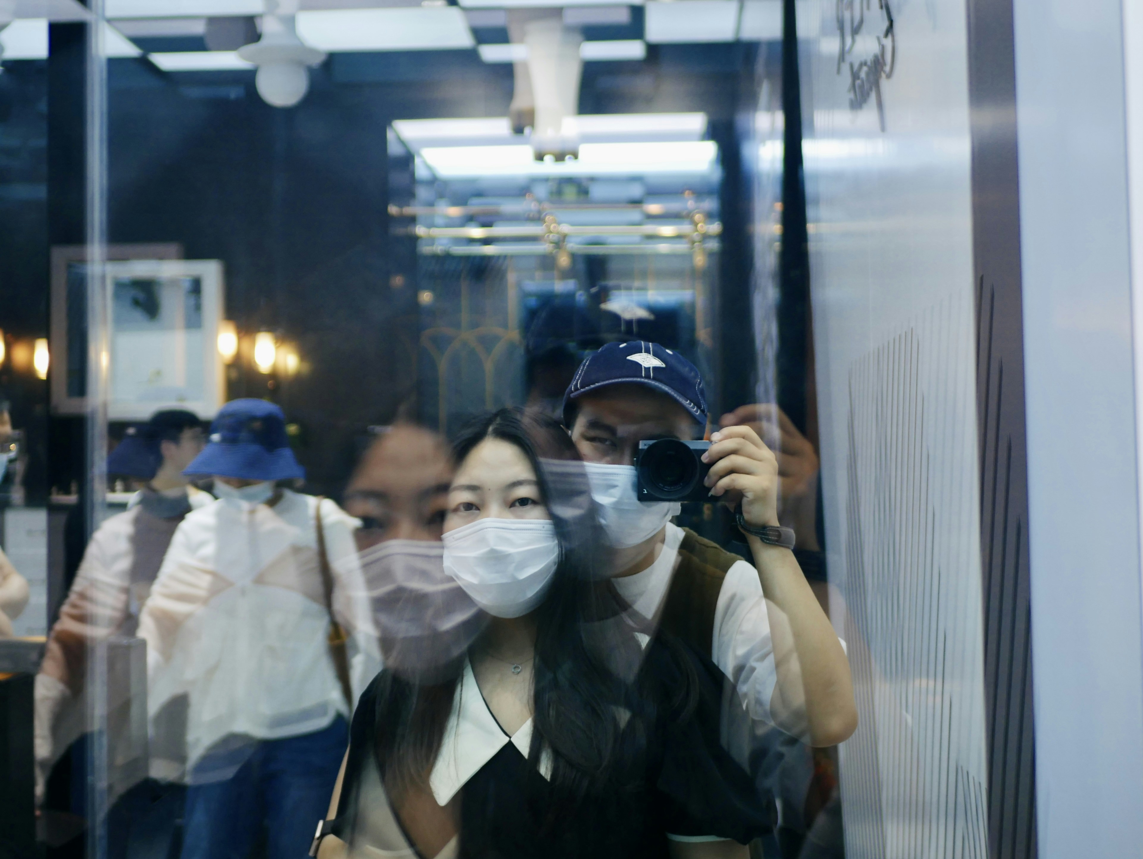 woman in black leather jacket wearing black sunglasses
