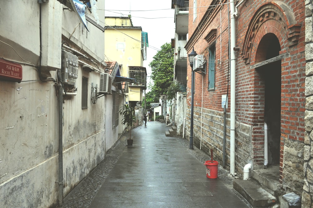 red plastic bucket on the street