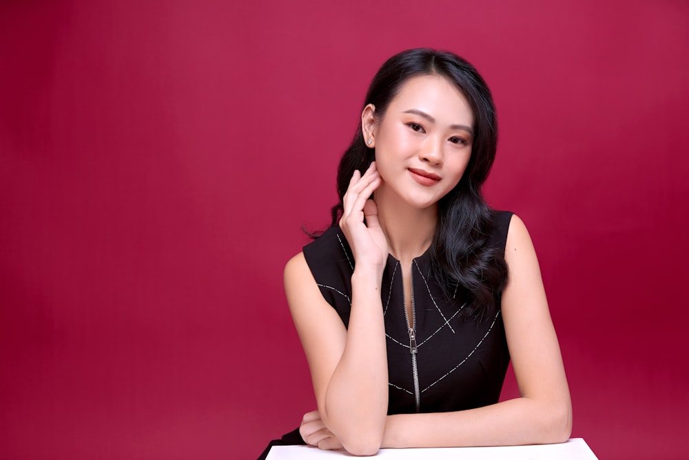 woman in black sleeveless dress