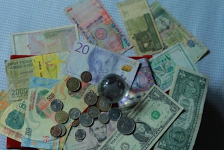 a pile of money sitting on top of a table