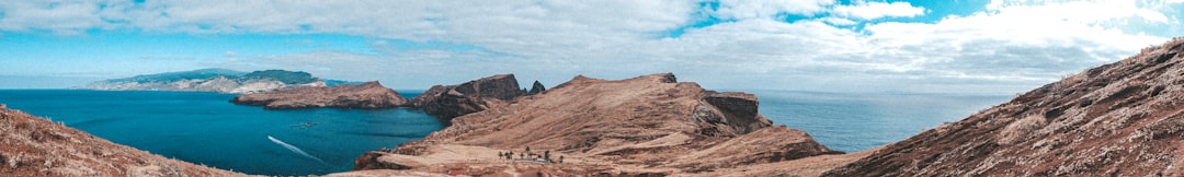 brown mountain under blue sky during daytime