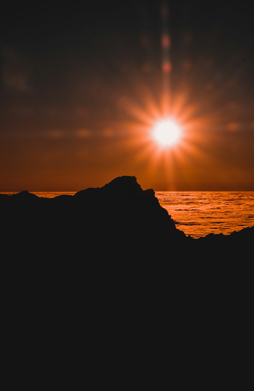 silhouette of mountain during sunset