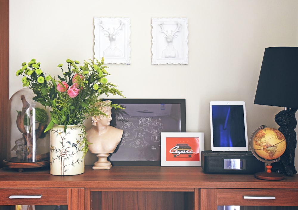 gray flat screen tv on brown wooden tv rack