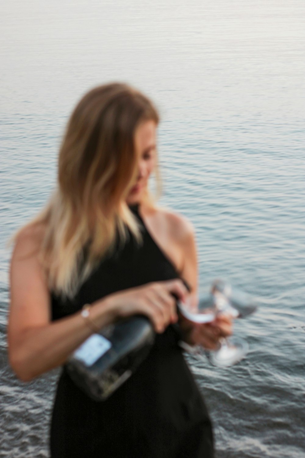 woman in black tank top sitting on black and gray water pump