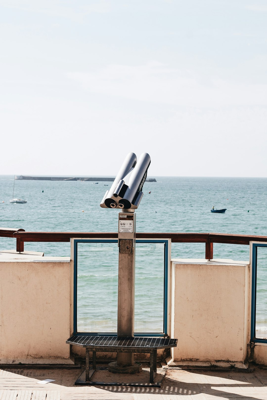 brown and white concrete dock near sea during daytime