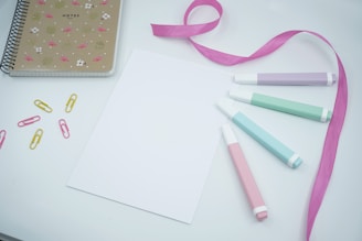 pink ribbon on white paper