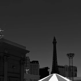 An artistic black-and-white cityscape with sharp contrasts and dynamic angles.