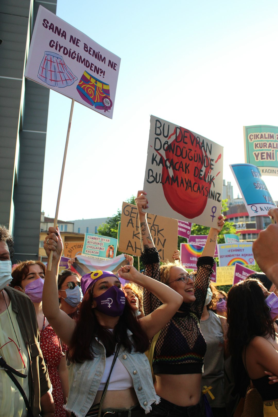 people holding happy birthday banner during daytime