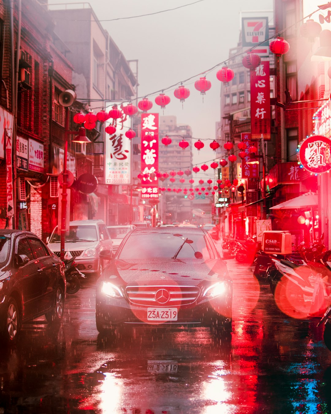 red car on road during night time