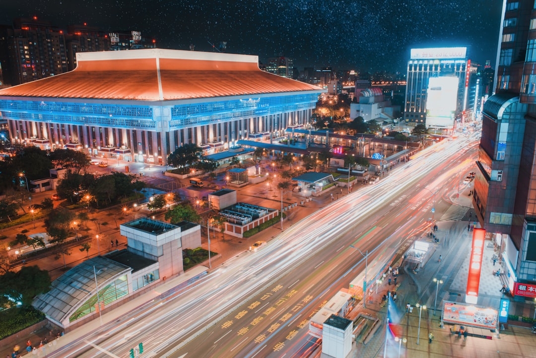 cars on road near building during night time