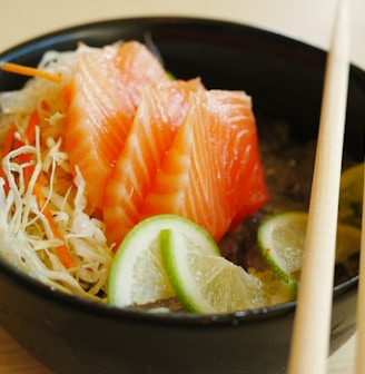 white chopsticks on black ceramic bowl