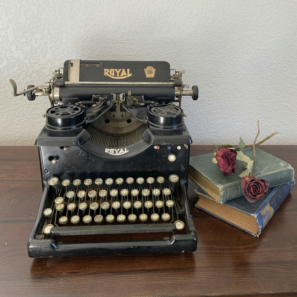 black and white typewriter on brown wooden table