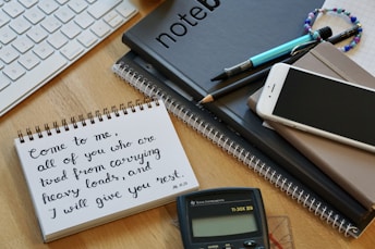 white paper document beside black click pen