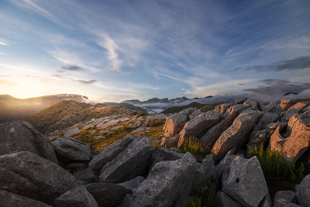 gray rocky mountain under blue sky during daytime