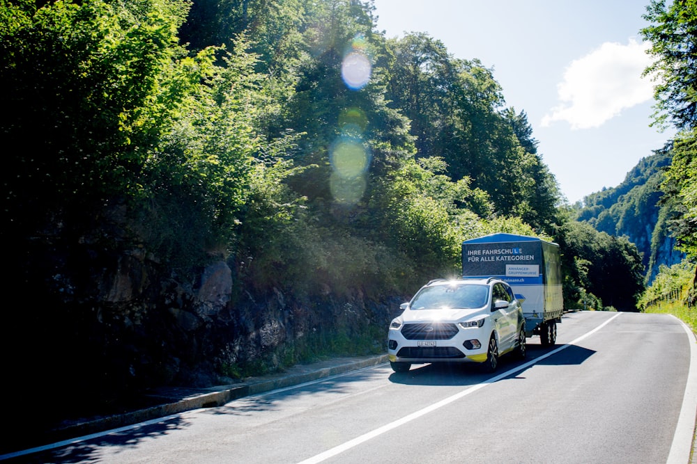 white car on road during daytime