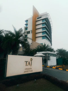 Outdoor view of the hotel entrance near the bustling Tajganj area