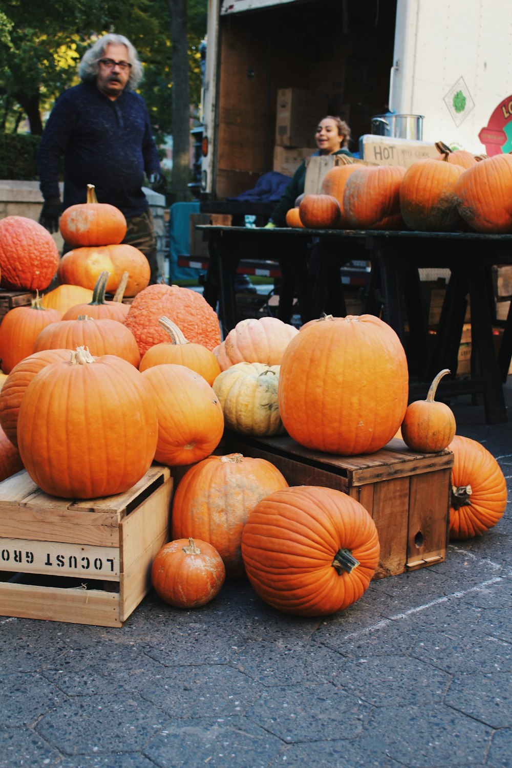 orange pumpkins on brown wooden crate