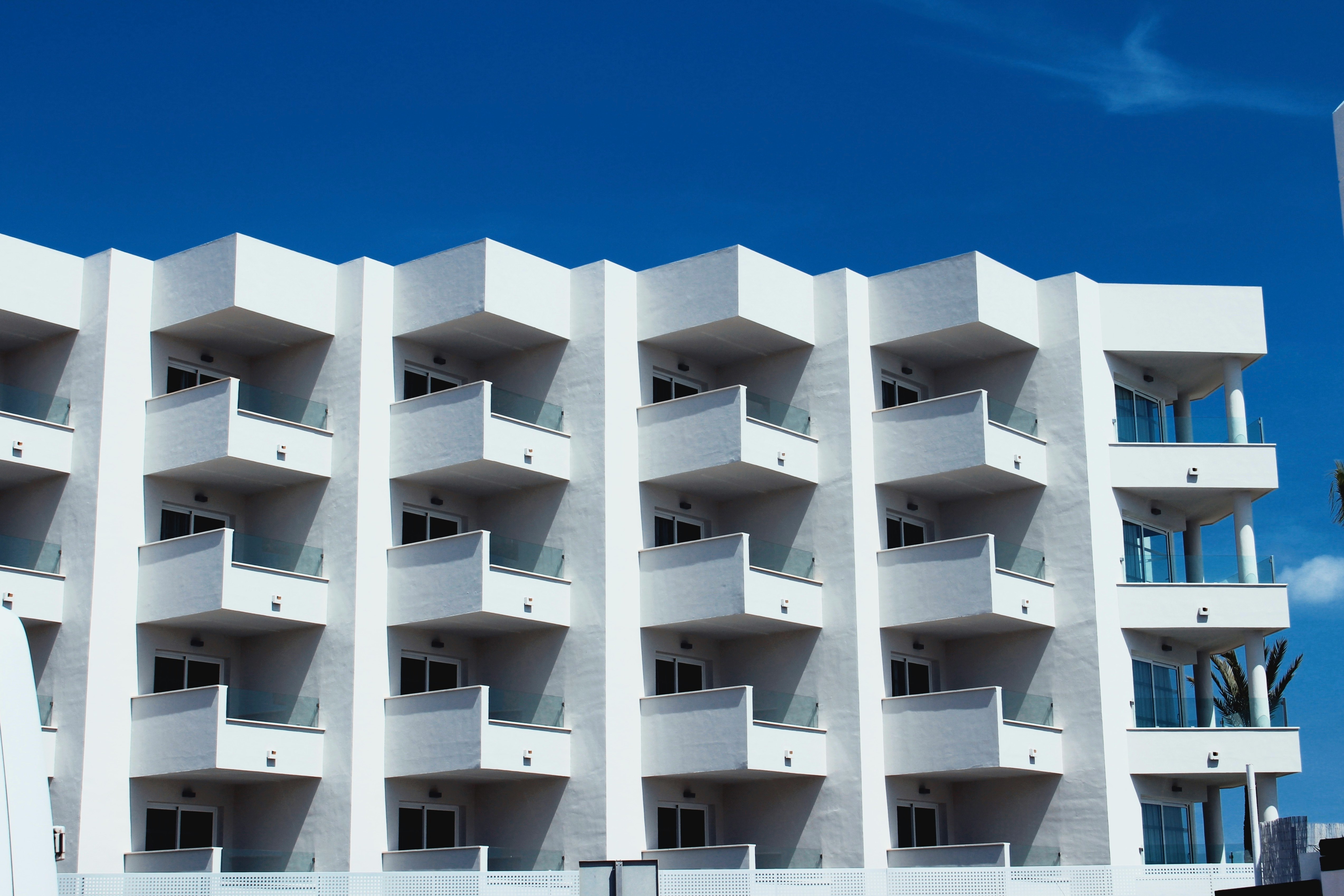 white concrete building under blue sky during daytime