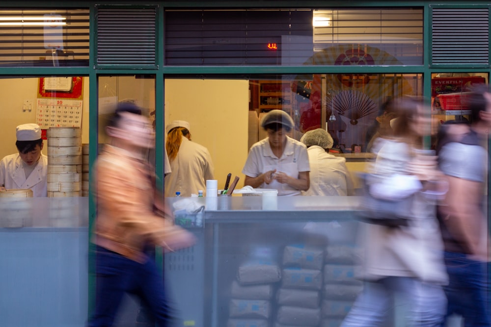 people standing in front of table