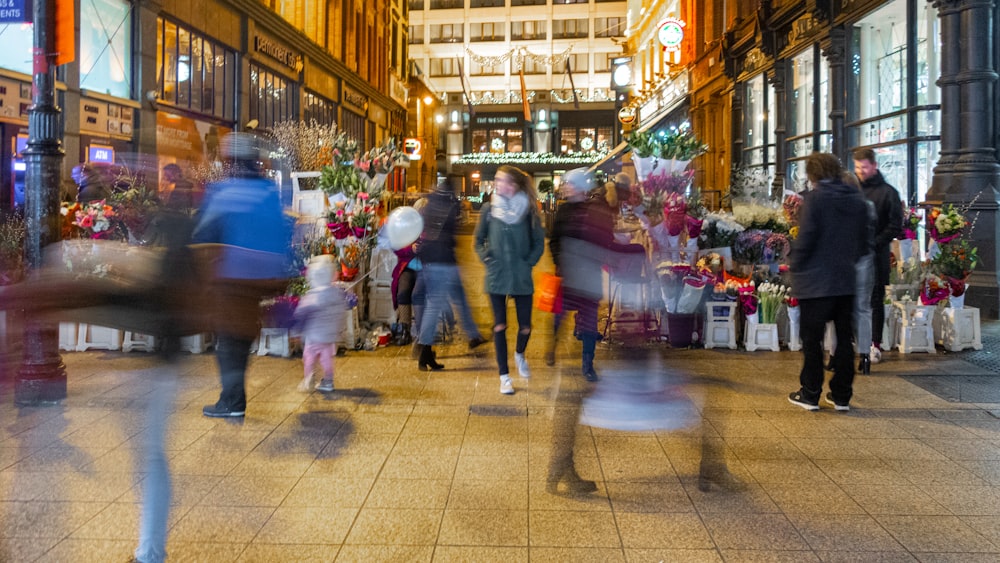 people walking on street during nighttime