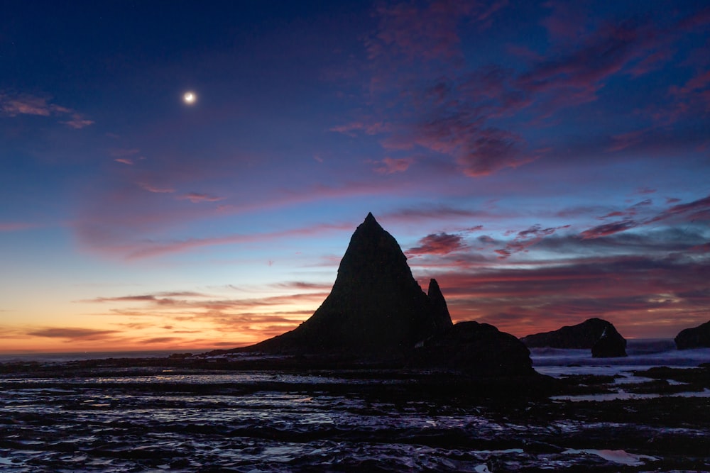 silhouette of mountain during sunset