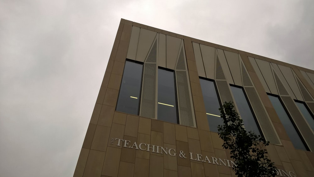 low angle photography of brown concrete building