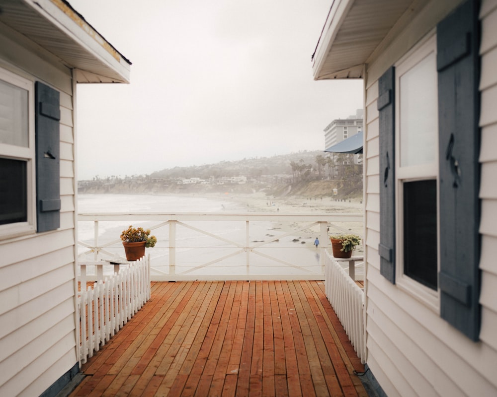 white wooden fence on brown wooden dock during daytime