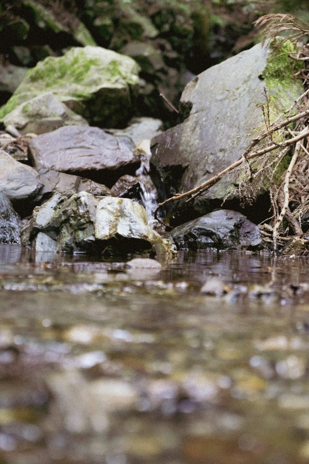 gray rocks on body of water