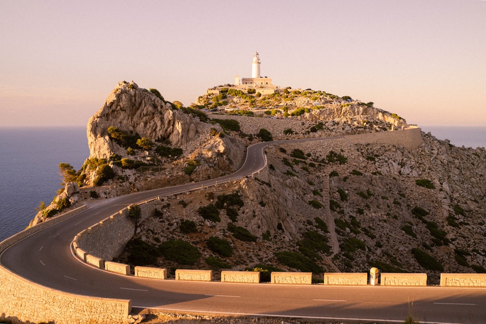 white and brown concrete building on top of mountain during daytime