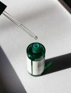 green and white plastic bottle