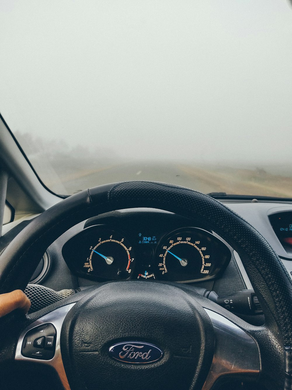 person driving car during daytime