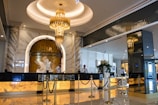 gold chandelier on white ceiling