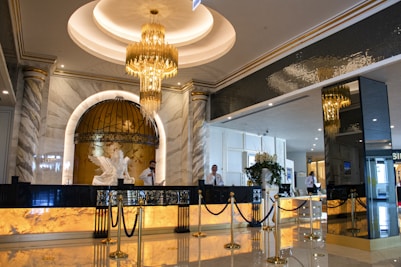 gold chandelier on white ceiling