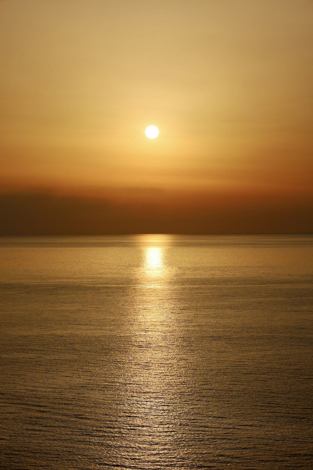 body of water during sunset