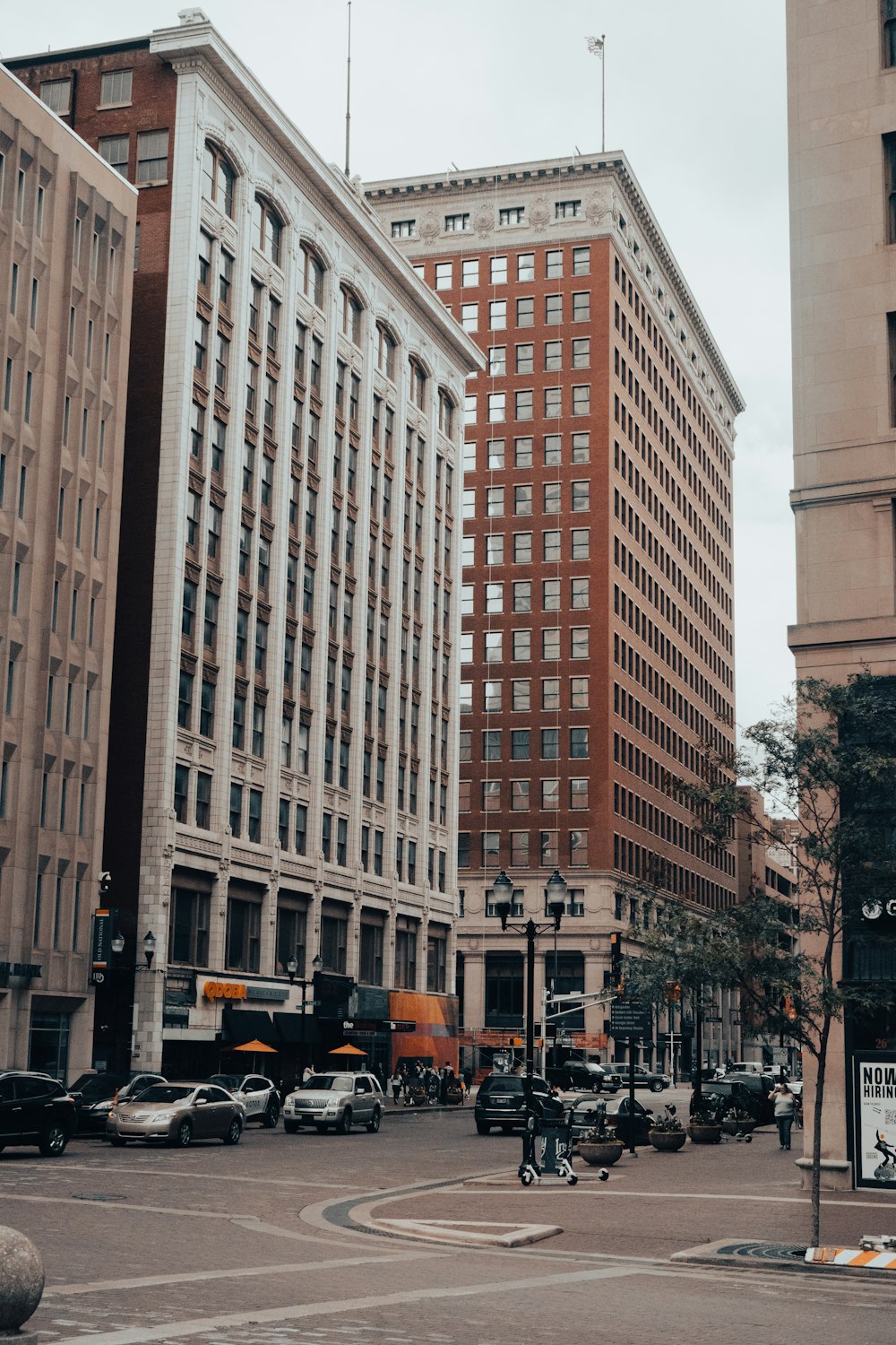 people walking on street near high rise buildings during daytime