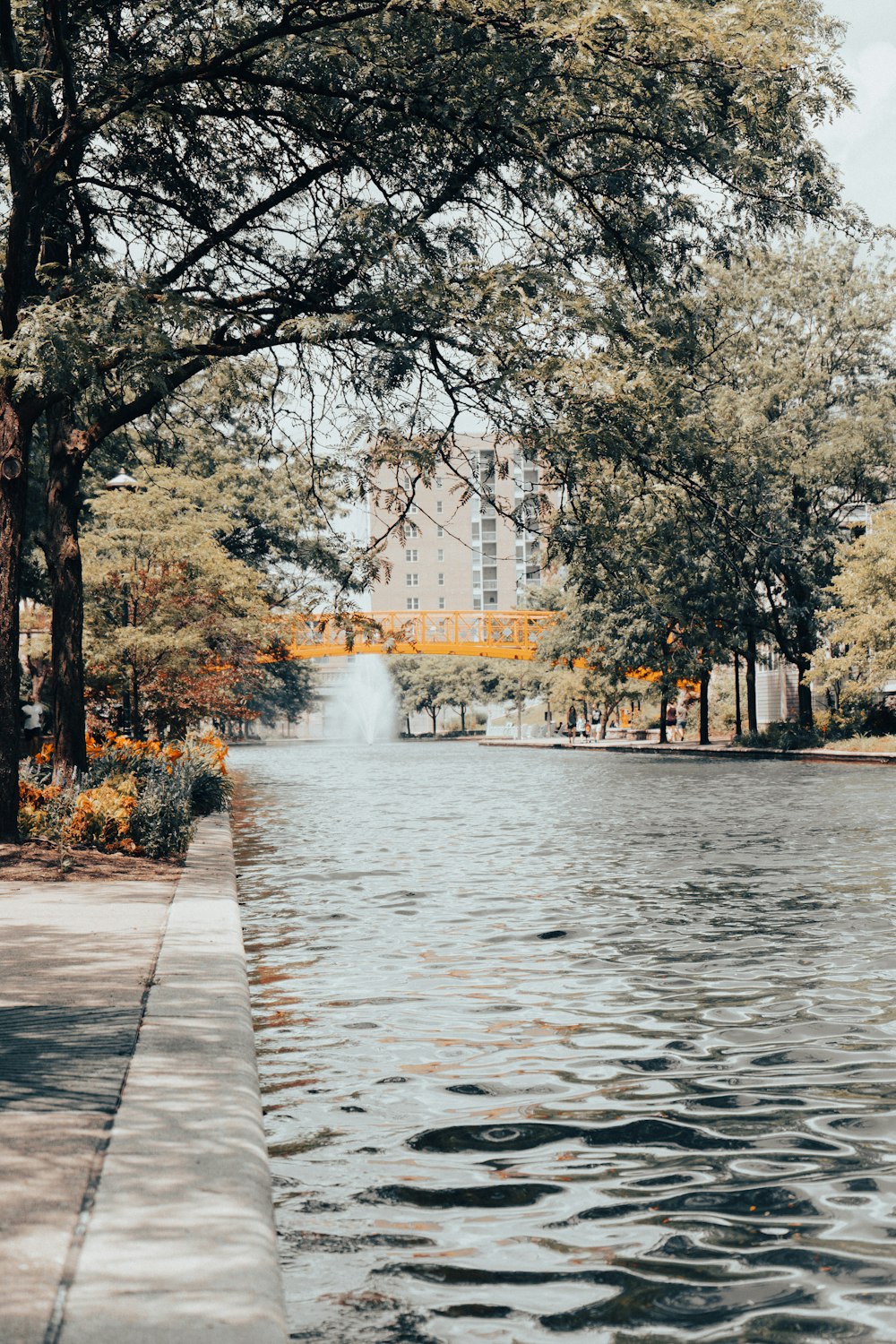 white concrete building near body of water during daytime