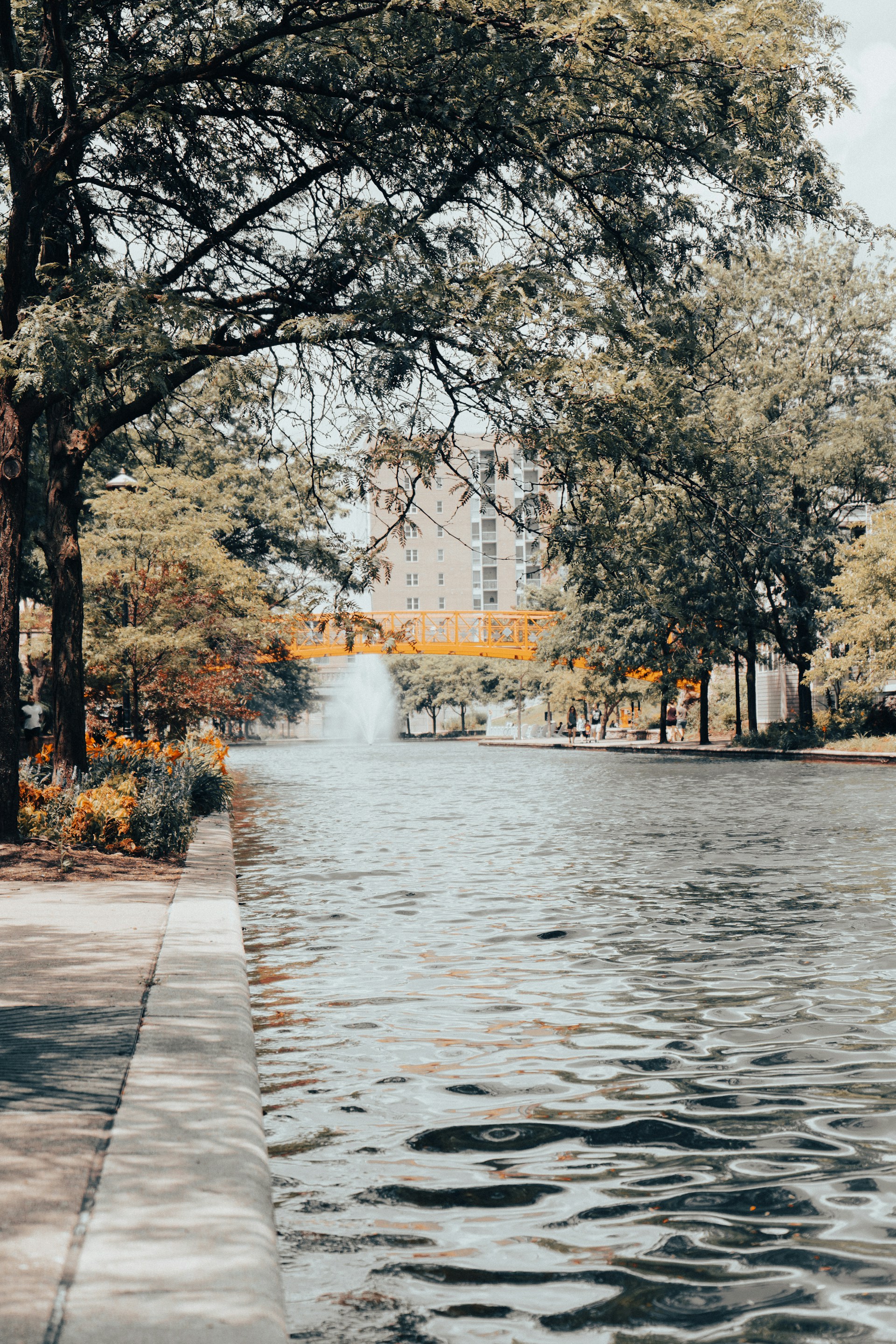 white concrete building near body of water during daytime