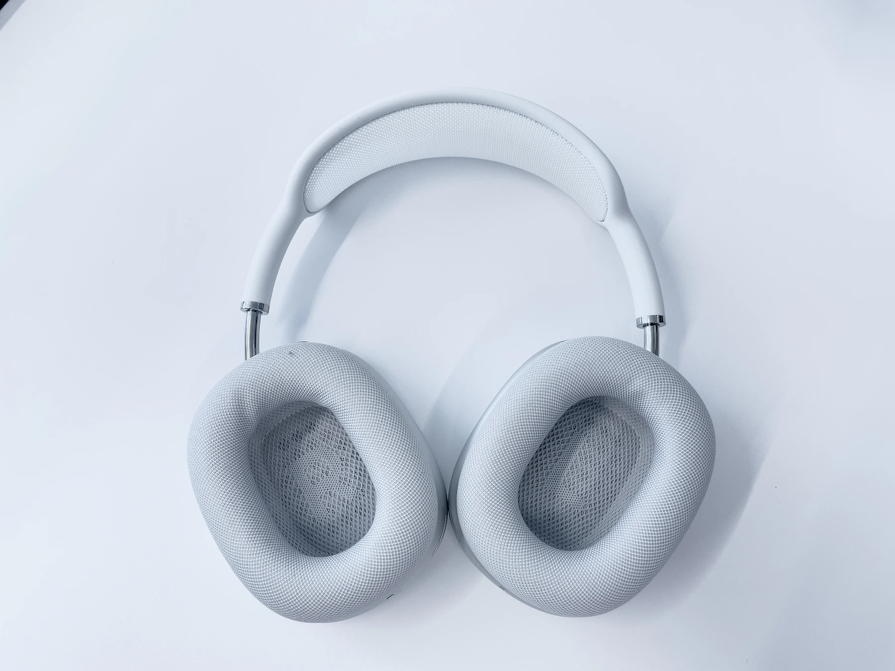 White AirPods Max headphones on a white background