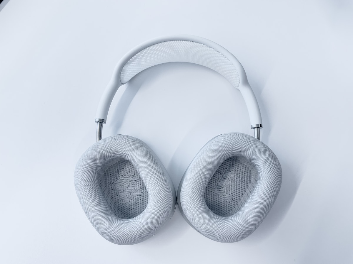 White wireless headphones on white surface