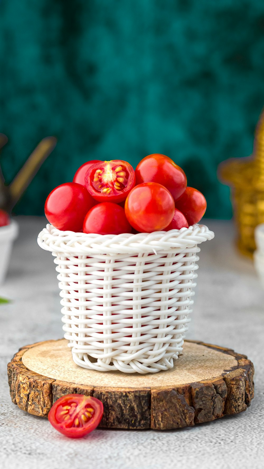 red apple fruits on white woven basket