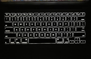 Before and after shots of a MacBook keyboard cleaned and restored.