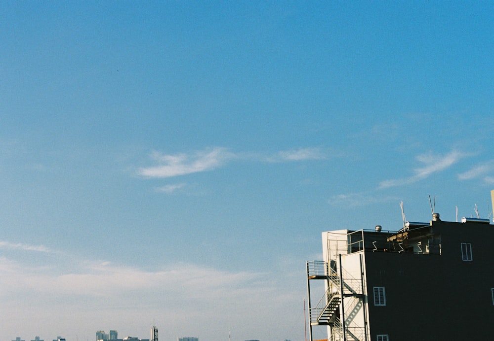 white and black building under blue sky during daytime