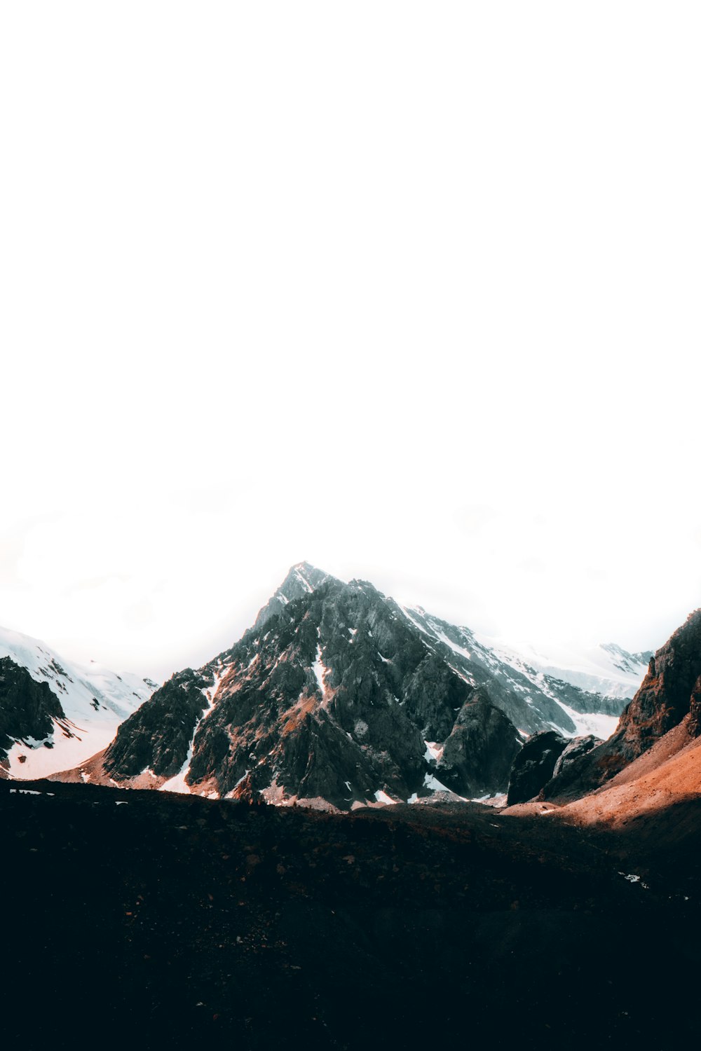 snow covered mountain during daytime