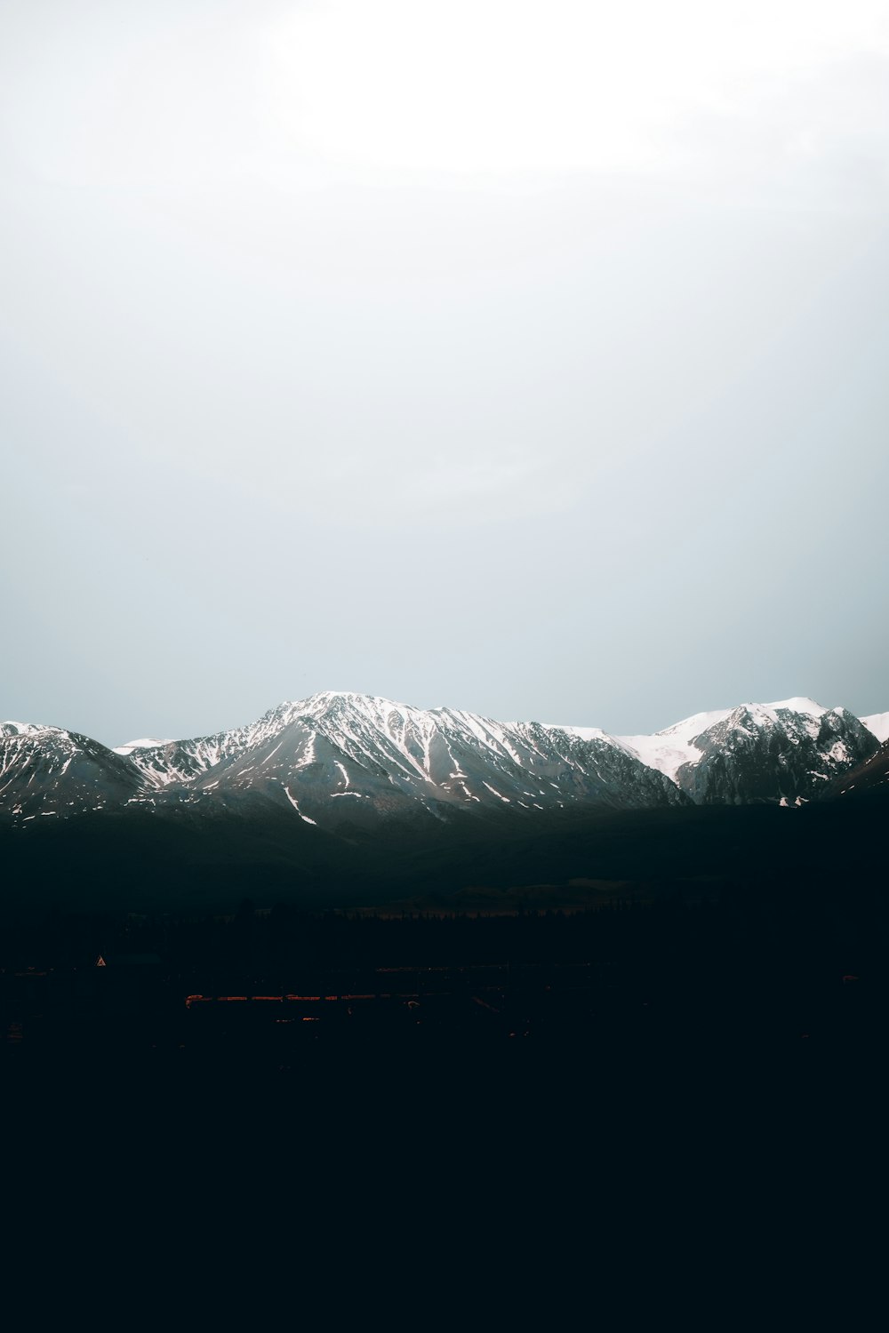 snow covered mountain during daytime