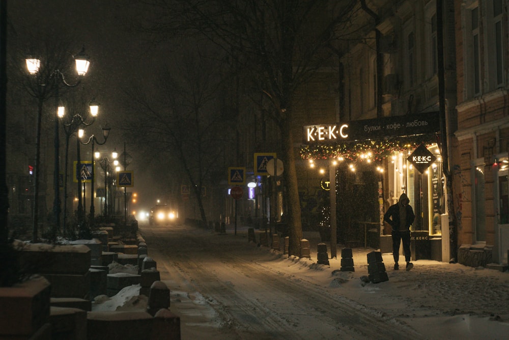 people walking on street during night time