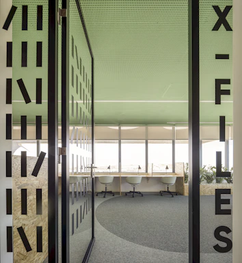 green and white glass building