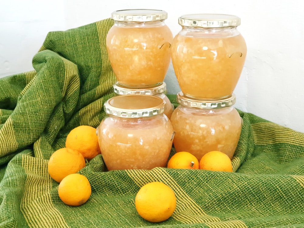 clear glass jar with yellow fruits