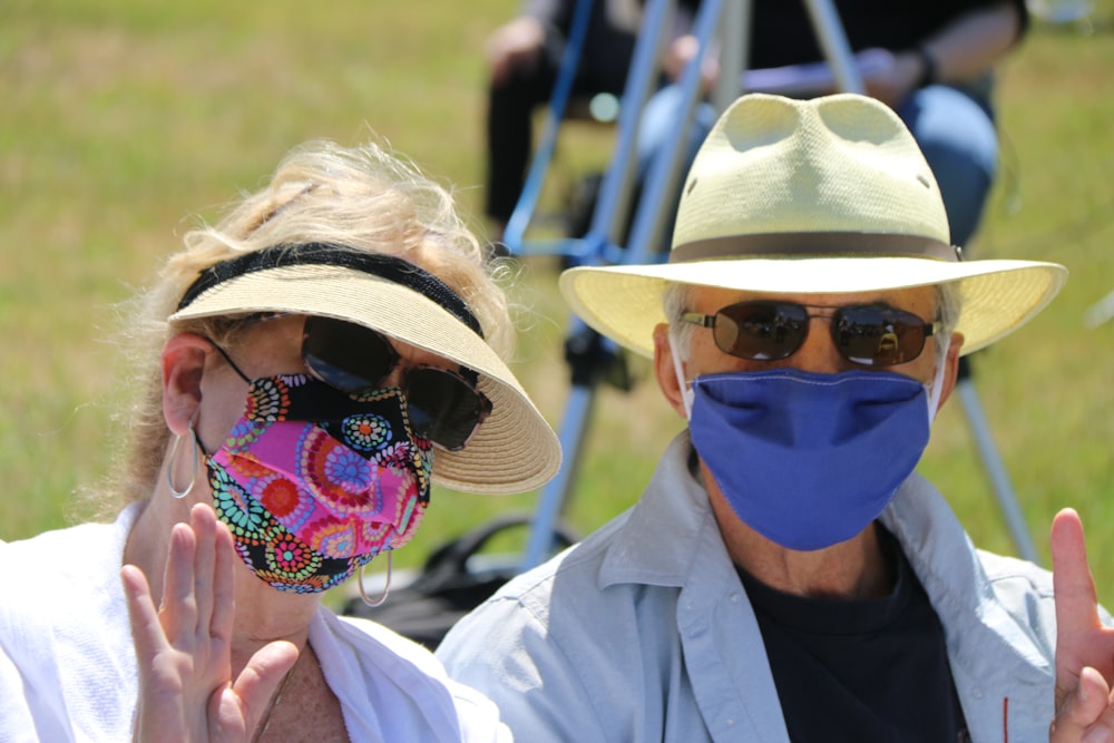 person wearing blue mask and brown hat