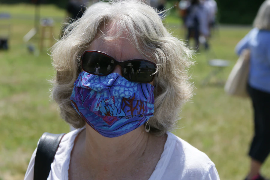 woman in blue and black sunglasses