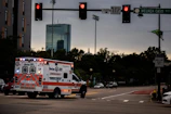white and red fire truck on road during daytime